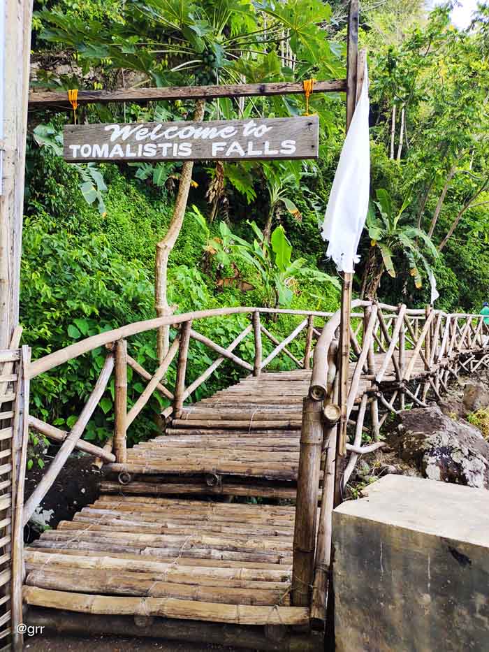 Entrance to Tomalistis Falls made up of wood and bamboo.
