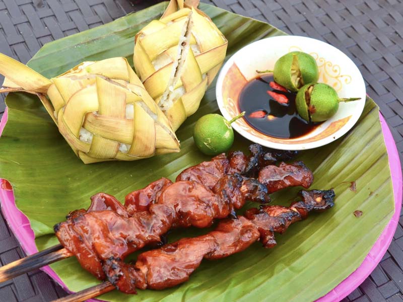Delicious BBQ with dipping sauce and two extra rice in "puso" form.