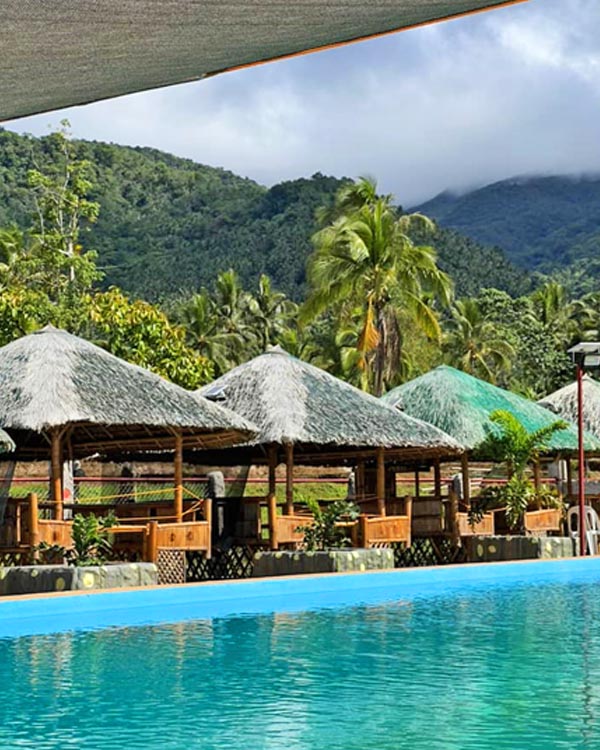 Cottages in front of the swimming pool.