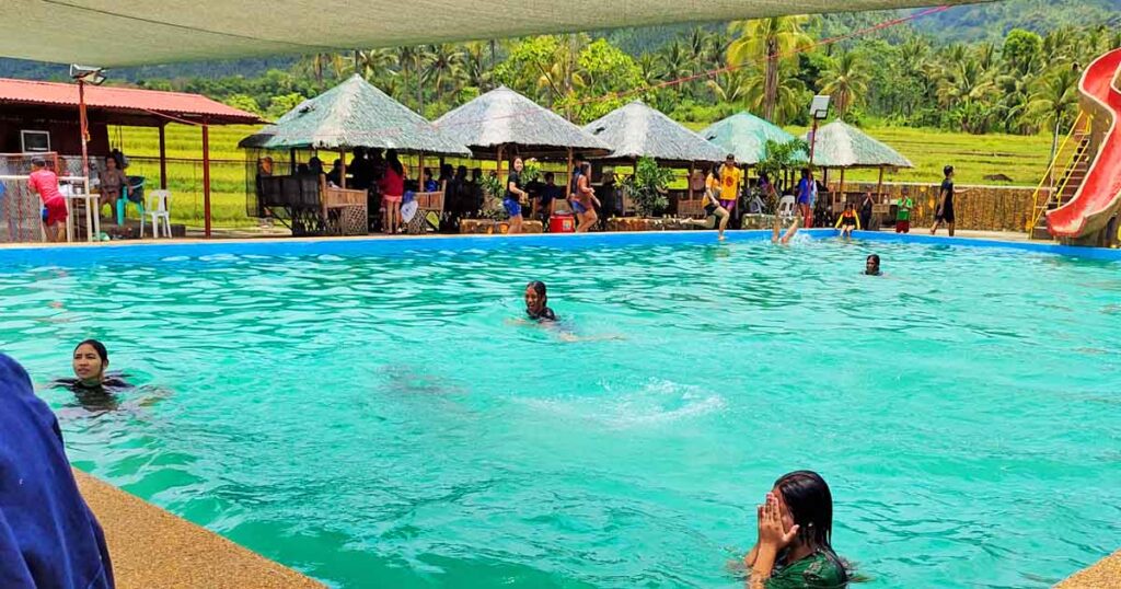 People enjoying the swimming pool.