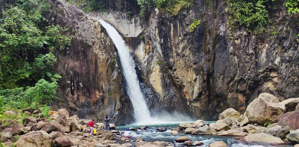 Some visitors taking a photo near Tinago falls.