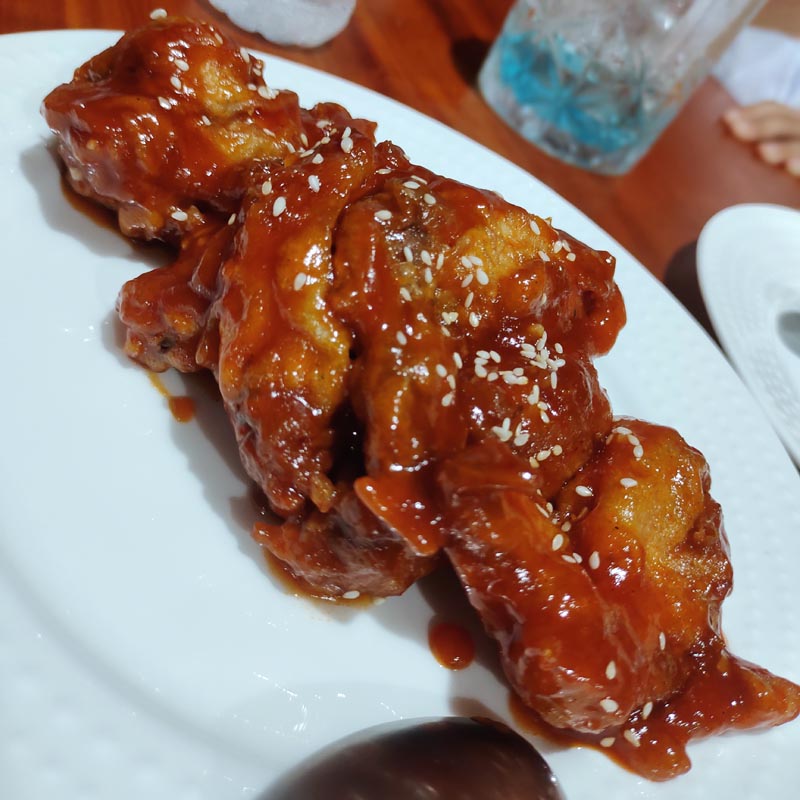 Buffalo wings served on a plate.