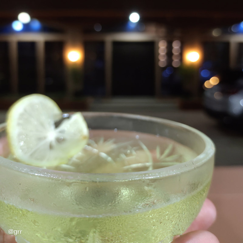 Holding a glass of Celestino's Delight.
