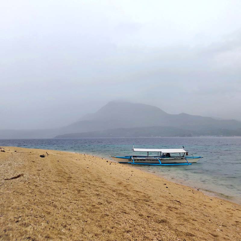 The Mt. Panamao with scattered rainshowers as seen from Dalutan Beach.